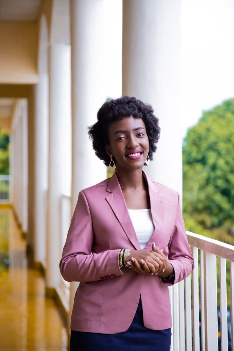 Portrait of Carol Bennett, Practice Manager at Riverbend Animal Hospital, smiling in a pink blazer